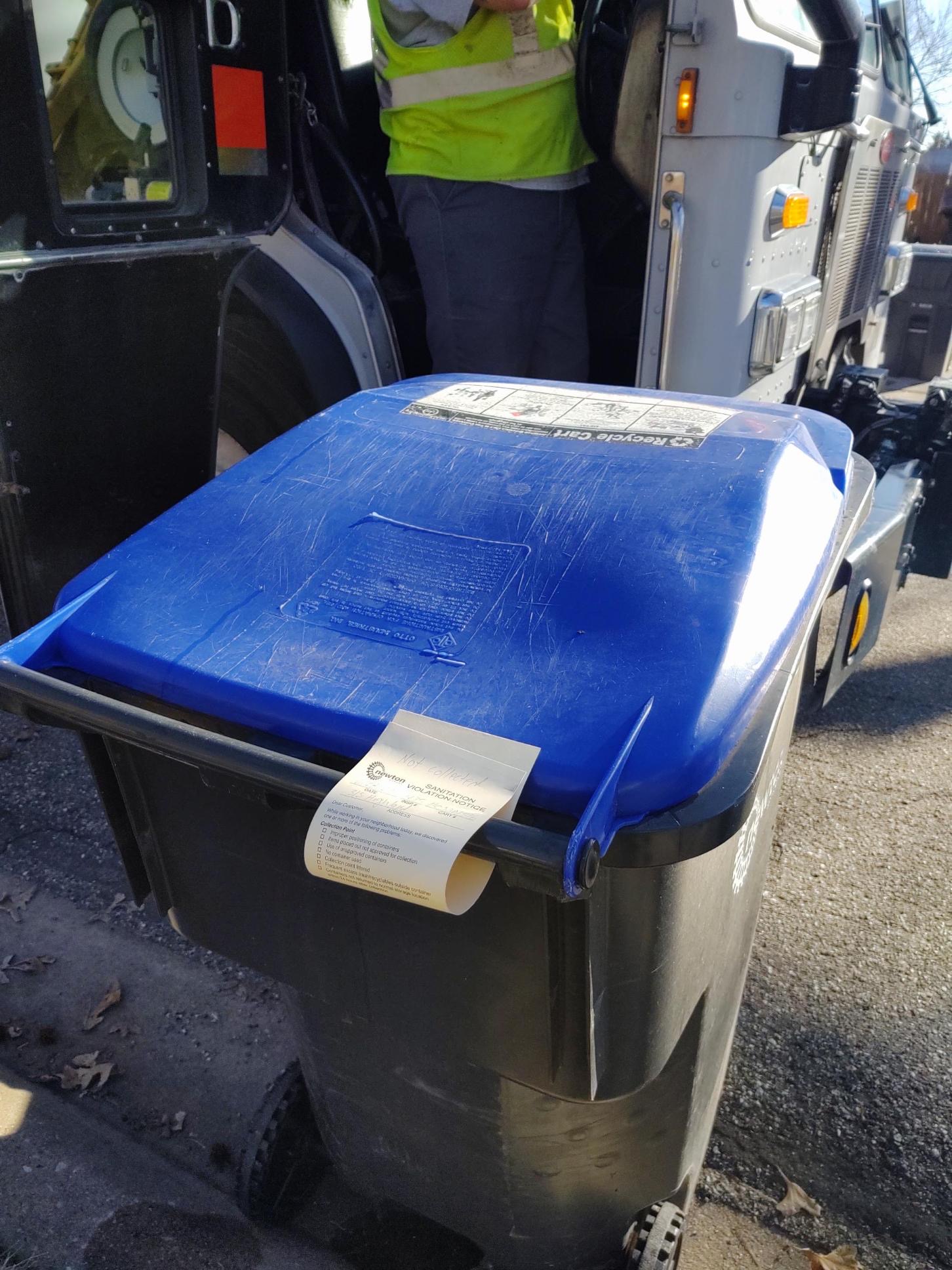 Recycle violation tag on a cart